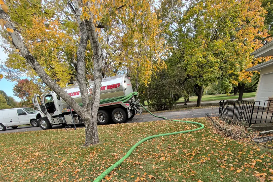 Emergency service call — truck and hose on site